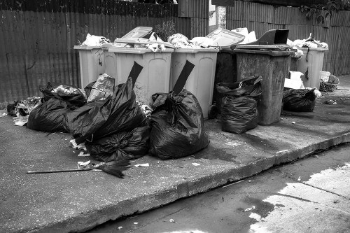 Commercial waste containers outside a Raynes Park business