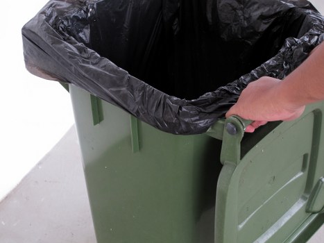 Clean and organized waste disposal area in Raynes Park
