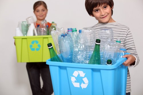 Workers sorting recyclable materials at a commercial site